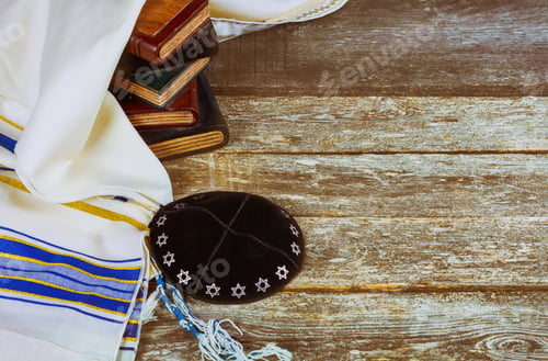 Preview: Jewish ritual with kippah and talit praying in the Jewish hebrew prayer book on a synagogue