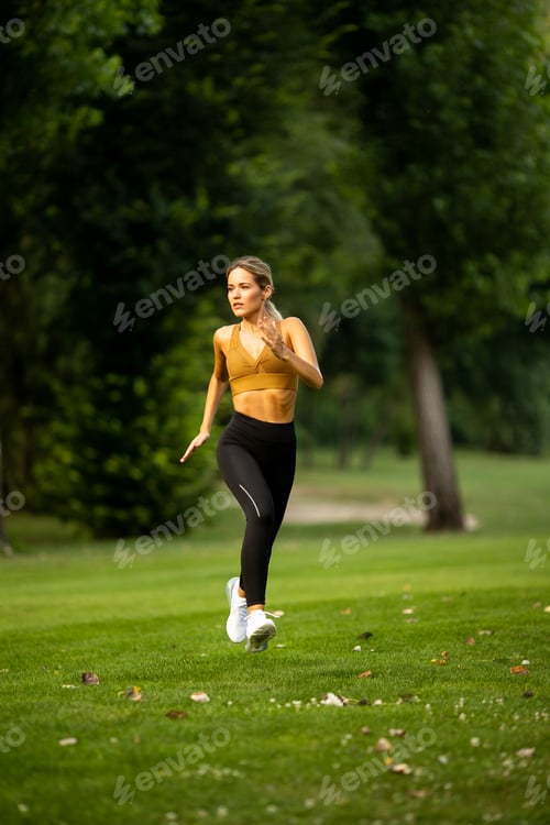 Preview: Pretty young woman running in the park