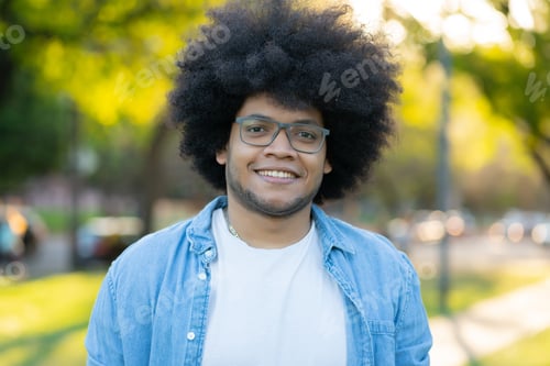 Preview: Portrait of young latin man outdoors.