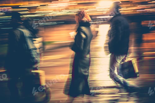 Preview: People walking fast on the street at night time