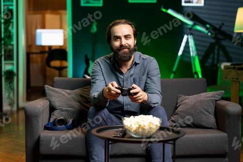 Preview: Man Plays Video Games at Home with Popcorn