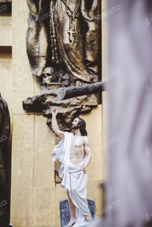 Preview: Vertical closeup shot of Jesus Christ statue with a blurred background