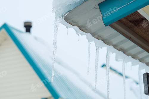 Preview: icicles hang on the roof. Danger in winter