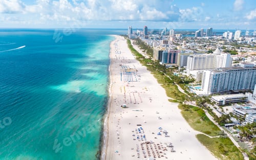 Preview: Drone aerial view at Miami South Beach Florida, Beach with colorful chairs and umbrellas
