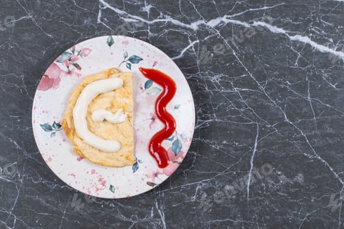 Preview: Mayonnaise on omelette next to ketchup , on the marble background