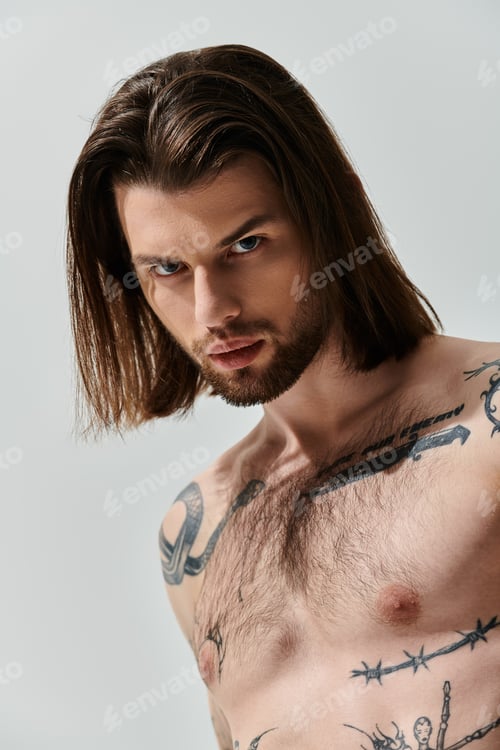 Preview: Stylish Man With Intricate Tattoos