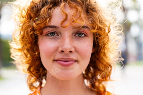 Preview: Portrait of cheerful and beautiful young girl with red hair