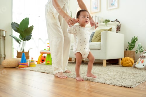 Preview: Toddler Learns to Walk With Support in a Cozy Living Room During Sunlight Hours