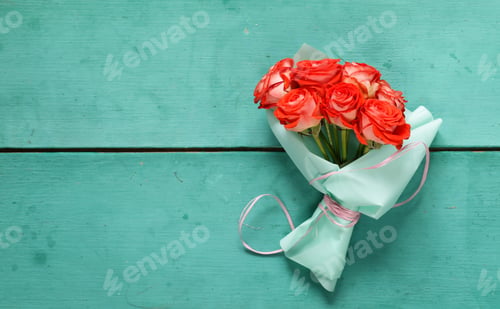 Bouquet of Roses Wrapped in Teal Paper