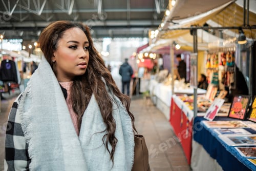 Preview: Portrait of young black woman in a street market in London.