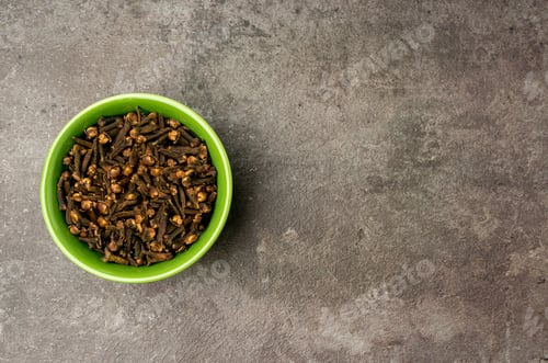 Preview: High quality photo of cloves with a dramatic concept on a dark background.