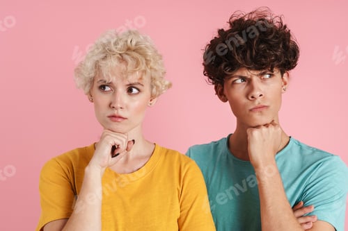 Preview: Portrait of a pensive teenage couple standing isolated