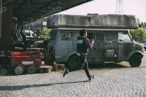 Preview: Photojournalist running with camera and helmet