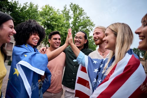 Preview: Cheerful group of young people holding the United States flag and the European Union flag