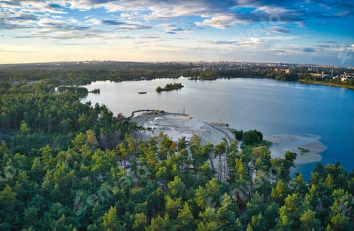 Preview: Lake near the forest and the city in the background