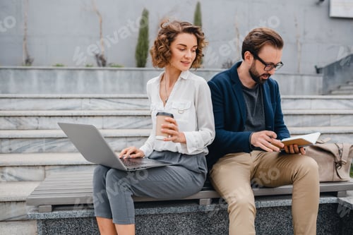 Preview: man and woman working together in park