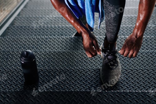 Preview: Athlete tying shoe laces