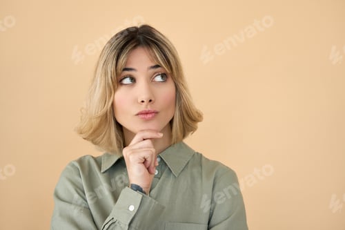Preview: Curious blonde get z girl looking interested aside thinking isolated on beige.
