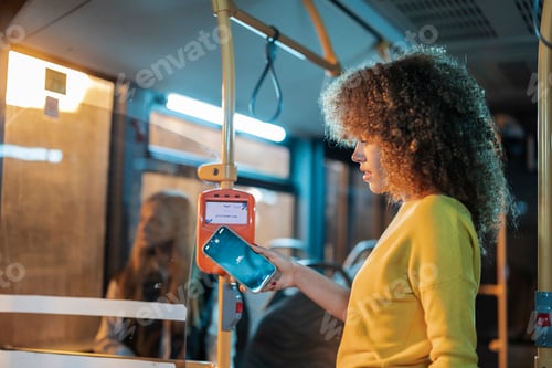 Preview: Woman paying bus fare using contactless smartphone technology