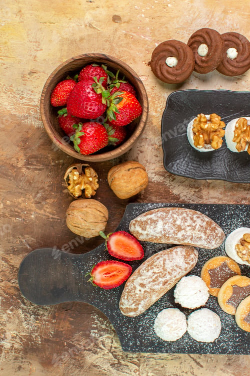 Preview: top view yummy sweets with fruits candies and cookies on the wooden desk sweet sugar biscuit