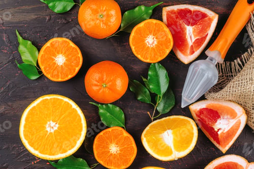 Preview: Sliced citrus fuits juicy on table close up