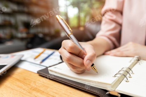 Preview: Business strategy concept. Close up shot businesswoman writing notes in notebook