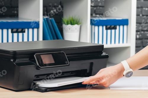 Preview: Woman making photocopy using copier in office