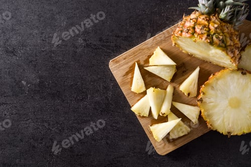 Preview: Fresh pineapple slices on cutting board