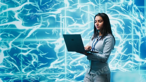 Preview: Software developer solving tasks on laptop, running artificial intelligence