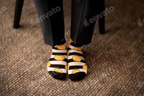 Preview: Two feet wearing socks with lemon prints
