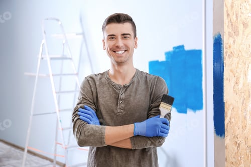 Preview: Portrait of male decorator with brush indoors