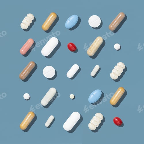 Preview: Medical capsules and pills in a lines on blue top view, hard shadow. Medicine and healthcare