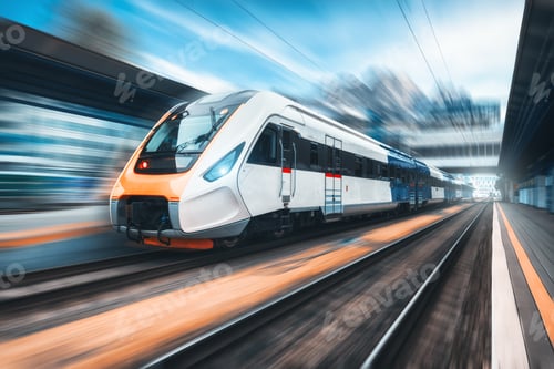 Preview: High speed train in motion on the railway station at sunset
