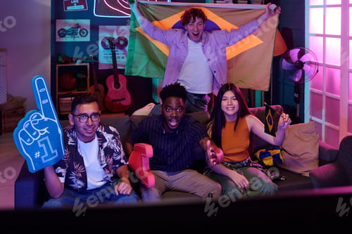 Preview: Diverse Young Adults Celebrating Sports Victory While Watching Television
