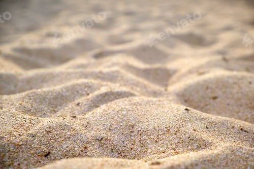 Preview: Close up of clean yellow sand surface covering seaside beach