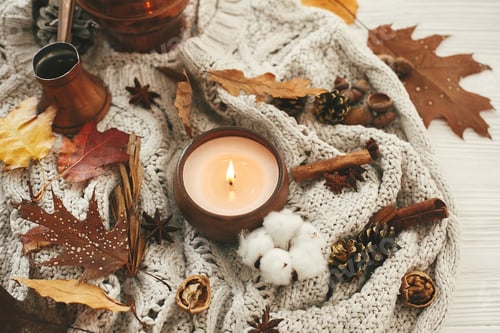 Preview: Hygge lifestyle. Candle with berries, fall leaves