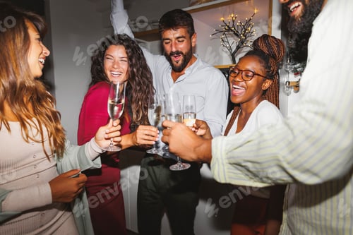 Preview: Friends drinking champagne and dancing at New Year party
