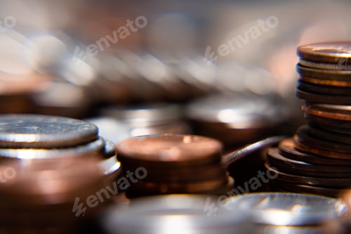Preview: Nickels dimes and quarters with a shallow depth of field and selective focus about to collapse