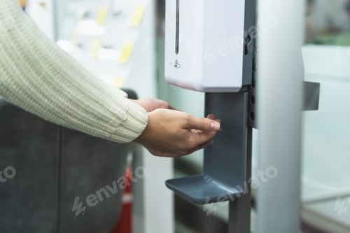 Preview: Cleaning, washing hands using automatic sanitizer dispenser concept.