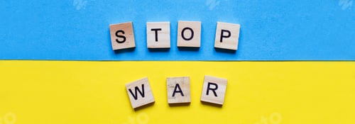 Preview: the inscription stop war made by wooden cubes on the ukrainian flag background