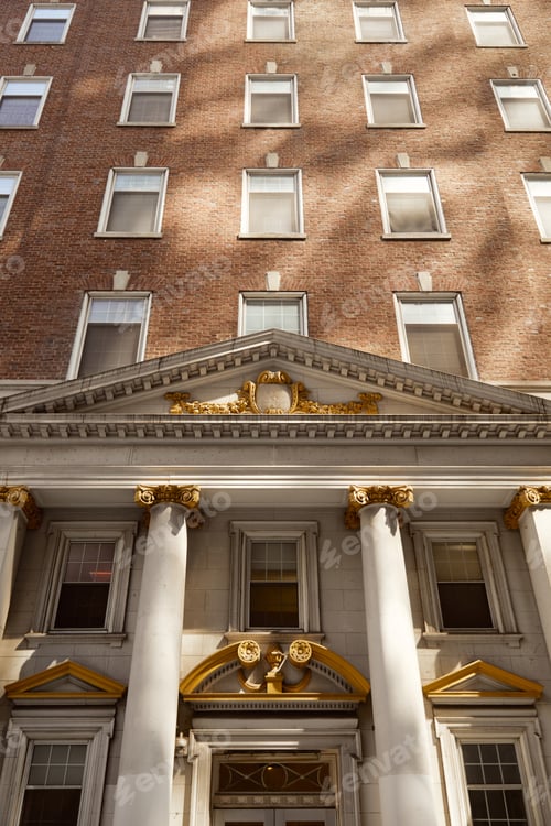 Preview: vintage architecture of new york city, low angle view of brick building with columns and portico
