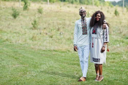 Preview: African couple in traditional clothes at park.