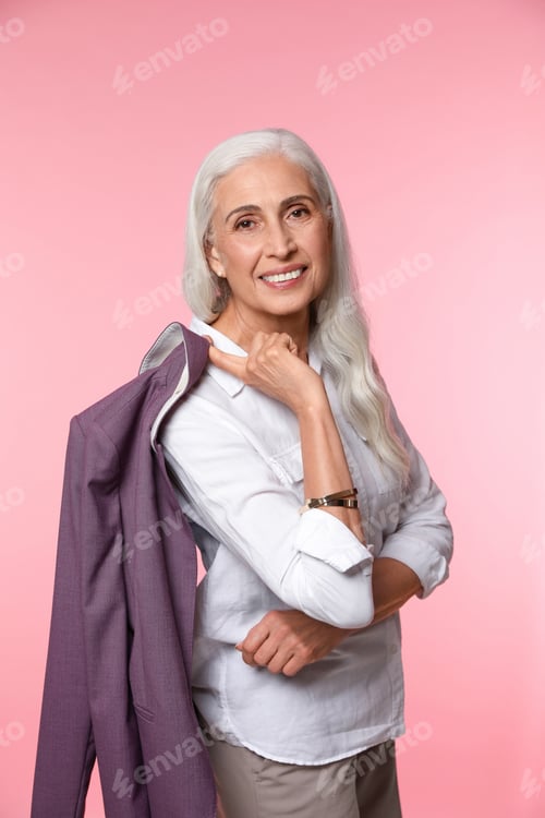Preview: Portrait of beautiful mature woman on pink background