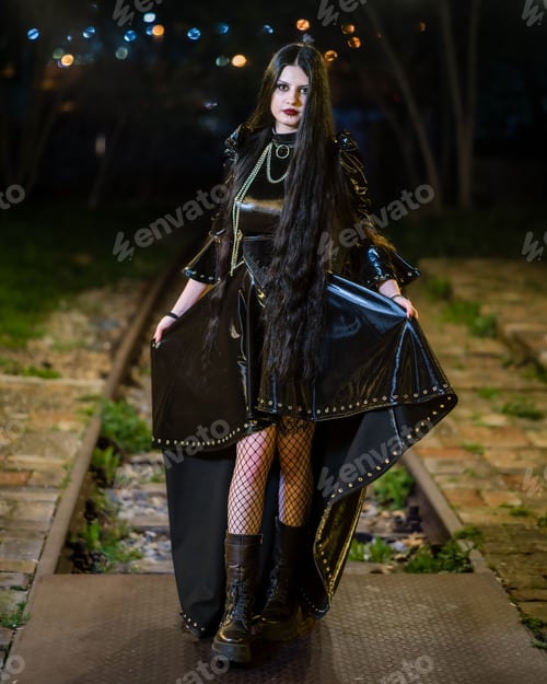 Preview: Portrait of a hot woman in a gothic costume posing outdoors at night