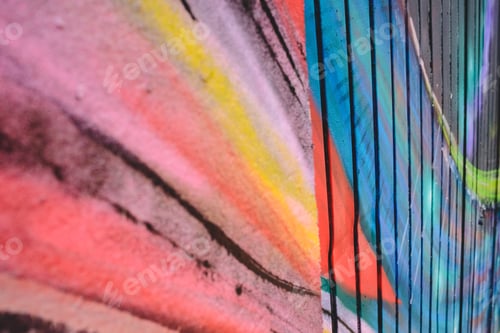 Preview: Detail of an anonymous street graffiti with many colors, cheerful urban background.