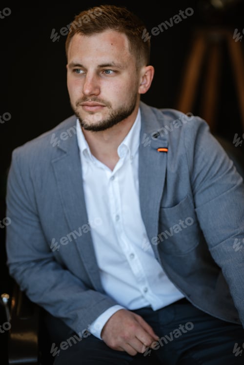 Preview: portrait of a young guy groom at the training camp in the barbershop