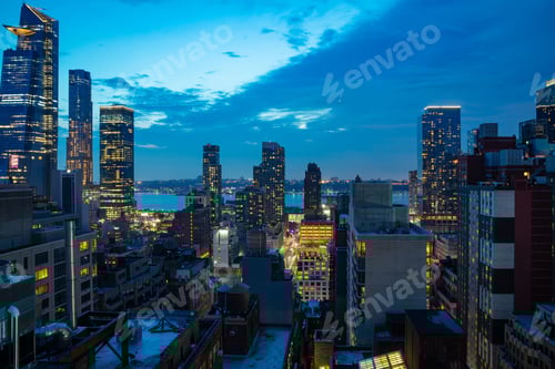 Preview: Aerial view of Manhattan skyscrapers lights, New York city, blue sky in the evening