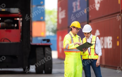 Preview: Portrait of Asian woman engineer and worker working with co-worker at overseas shipping container
