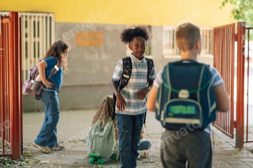 Preview: Elementary school students entering schoolyard during recess