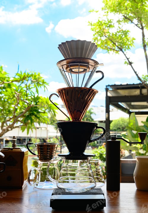 Preview: Barista experimenting with new flavors of drip coffee by stacking the dripper like a tower.